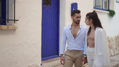 Romantic Ethnic Couple Kissing in Aged Town