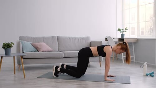 Young Woman Doing Yoga at Home