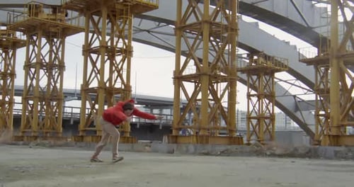 Young Adult Parkour Stunts in Urban Setting