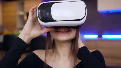 Woman Using Virtual Reality Headset in Apartment