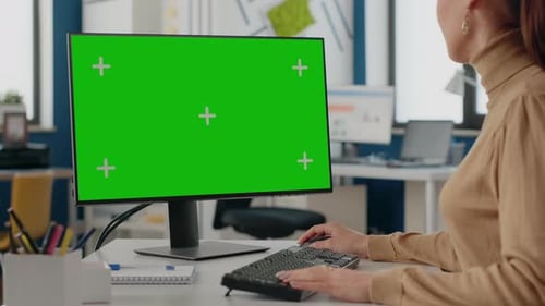 Close Up of Employee Using Green Screen on Monitor