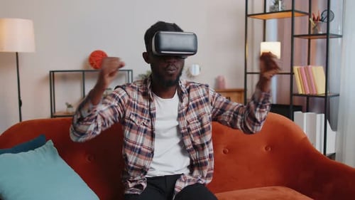 Man Using Virtual Reality Headset on Couch