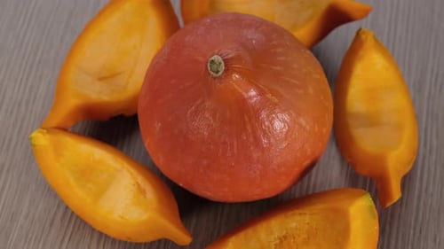 Fresh Orange Pumpkin with Cut Slices Close Up
