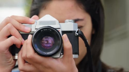 Woman clicking photo with digital camera 4k