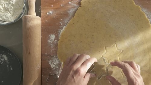 Top View Closeup Cutting Out Cookies for Christmas