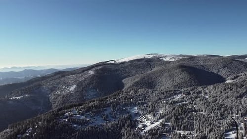 Aerial Video Forest Mountains Covered in Snow on a Sunny Winter Day, Drone Video with Cold Nature