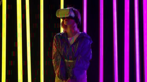 Woman Wearing VR Headset with Neon Lights