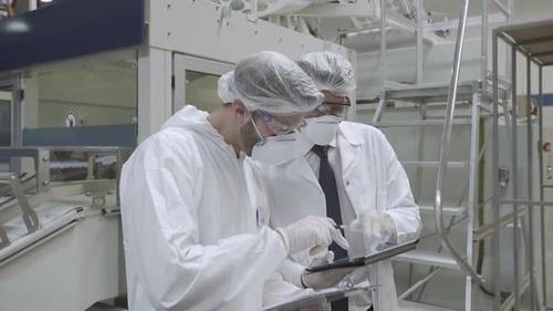 Scientists working in laboratory