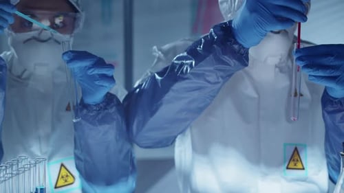 Scientists in Lab Perform Experiments with Petri Dishes