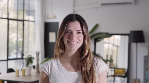 Smiling Woman Portrait in Bright Indoor Setting