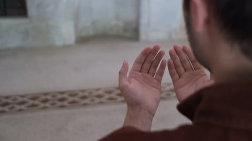 Young Adult Man Praying in Mosque
