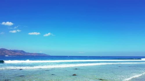 Wide birds eye abstract view of a sunshine white sandy paradise beach and aqua blue ocean background