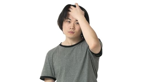 Young Adult Adjusts Hair on White Background