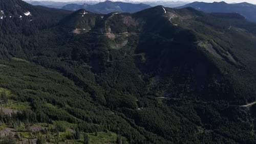 Mountain Aerial Slowly Panning Up To Reveal Mt Rainier Background