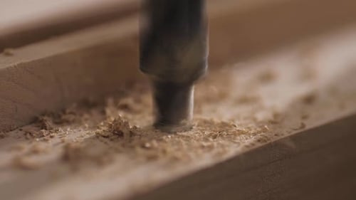 Macro Video of Drilling Holes in the Board with a Drilling Machine