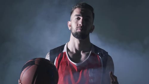 Serious Basketball Player in Smoky Studio
