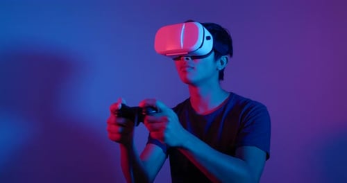 Man Plays Video Games with VR Headset