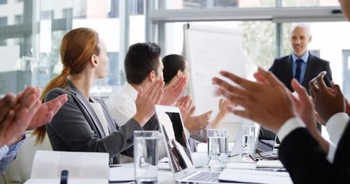 Diverse Group Applauds Business Presentation