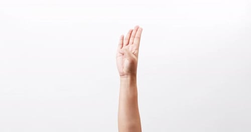 Female hands symbol with fingers for help isolated on a white studio background with copy space for