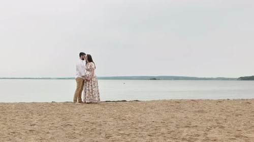Couple Romantic In Love Kissing near the sea water