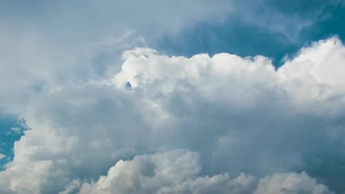 Timelapse of White Puffy Cumulus Clouds Forming on Summer Blue Sky