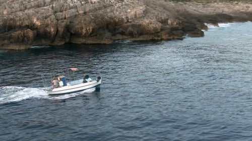 On A Motorboat Along The Coast