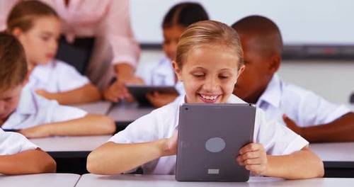Students Use Tablets in a Classroom Setting