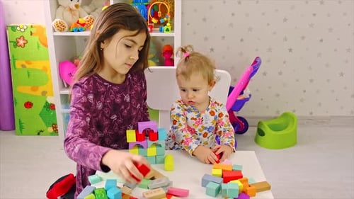 The Child Plays with Toys in the Room