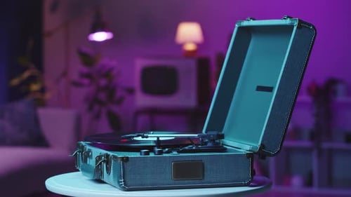 Record Player Spinning Vinyl Record in Dimly Lit Room