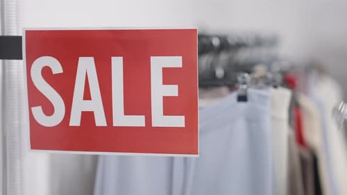 Sale sign in a clothing store close up