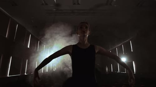 SLOW MOTION Prima Ballet Rehearses a Solo Performance Standing on the Stage of the Theater in Smoke