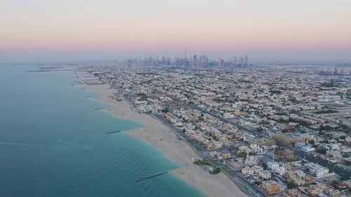 Aerial view of Dubai sea coast beach with downtown skyline, bay in United Arab Emirates or UAE.