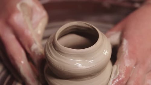 Pottery Workshop Wet Female Hands Shaping the Clay on the Wheel on the Pot Shape