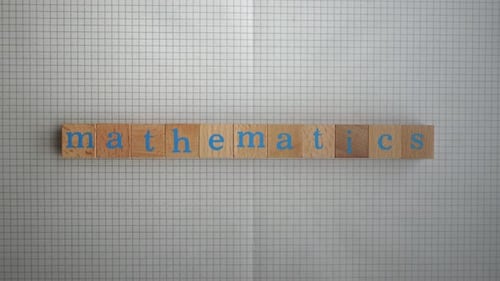 Wooden Blocks Spell the Word "Mathematics"