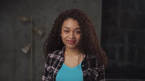 Woman Smiling and Blowing a Kiss to Camera