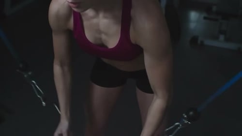 Woman Doing Cable Fly Exercise in a Gym