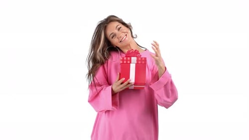 Woman Smiles and Holds a Gift on White Background