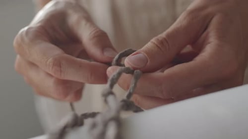 Woman Making Macrame Knot Close Up