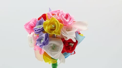 Bouquet of Ribbon Flowers Rotating on White