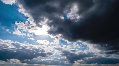 Dramatic Clouds Moving Across Blue Sky
