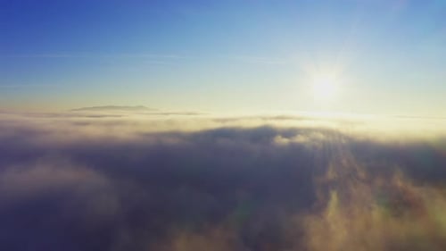 Wonderful View of Extraordinary Cloudy Valley and Bright Orange Sunset
