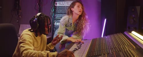 Multiethnic Colleagues Recording Music in Studio