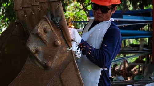 Professional men wearing goggles and construction gloves work in home workshop