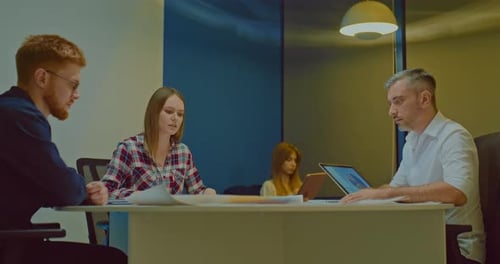 Beautiful Businesswoman Girl at a Business Meeting in a Modern Coworking Office