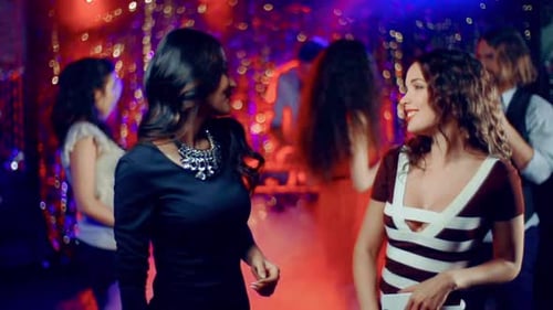 Young Adults Enjoy Dance Party in Nightclub