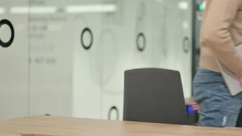 Young Adult Working on Laptop in Office