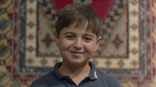 Smiling Boy Close Up Portrait In Home