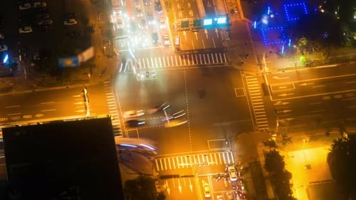 Brightly Illuminated Urban Intersection at Night from Above
