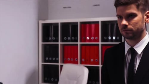 Attractive and Certain Sure in Self Businessman is Walking Inside Office Building