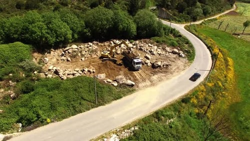 Trucks and Excavator Working